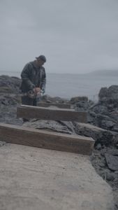 David Squibb helps construct a ramp on his neighbor's property. (National Geographic/Gil Cano)
