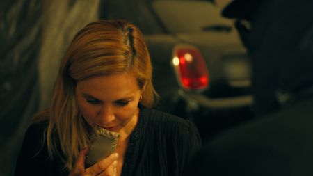 Mariana van Zeller smells a wrapped bar of hash. (National Geographic)