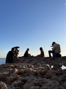 Mariana van Zeller sits with her best friend and cousin on the coast of Portugal. (National Geographic for Disney)