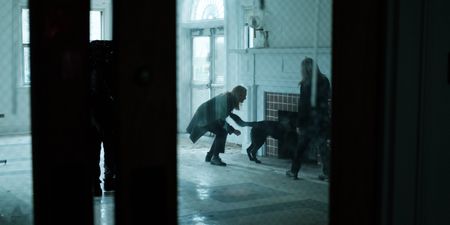 Mariana van Zeller watches Lisa's trained dog search a room. (National Geographic for Disney)