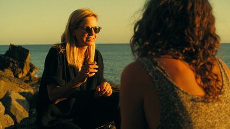 Mariana van Zeller sits with her friend Barbara and cousin Teresa on the coast of Portugal. (National Geographic)