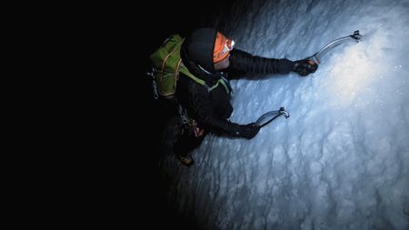 Conrad Anker climbs in the dark on the face of Lunag Ri, in the Himalayas.  (Mandatory credit: Red Bull Media House)