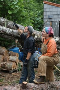 Dave Palmer helps Veronica Arrants remove threatening trees from her property. (National Geographic/Wayne Moss)