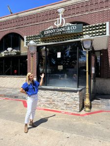 Mariana Van Zeller stands in front of Johnny Dang & Co. (National Geographic)