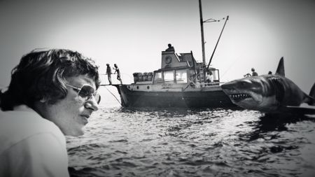 Director Steven Spielberg on the set of Jaws with the mechanical shark in the background. (Courtesy of Universal Studios Licensing LLC)
