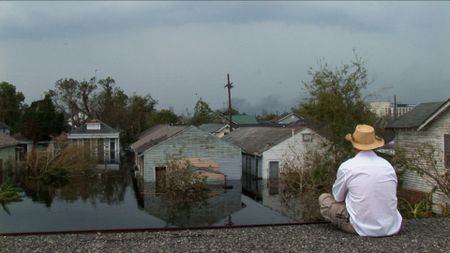 A man is stranded on a rooftop after Hurricane Katrina. (Wickes Helmboldt)