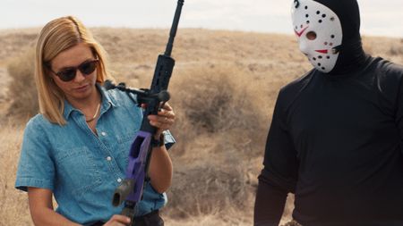 Mariana holds Dutch's ghost gun rifle during an interview. (National Geographic)