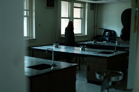 Mariana van Zeller watches Lisa's trained dog search a room. (National Geographic for Disney)