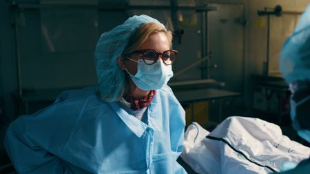 Mariana van Zeller watches workers carve cadavers for body part donation. (National Geographic)