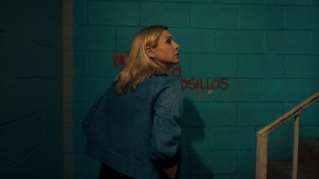 Mariana walks cautiously through a motel to meet for an interview. (National Geographic)