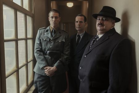 A SMALL LIGHT - Silberbauer, played by Daniel Donskoy, Gringhuis, played by Mark Ram, and Grootendorst, played by Victor McGuire, as seen in A SMALL LIGHT. (Credit: National Geographic for Disney/Dusan Martincek)