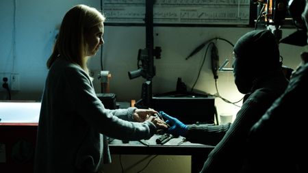 Mariana van Zeller inspects one of Tony's ghost guns. (National Geographic for Disney)