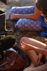 Mariana van Zeller sits with her best friend and cousin on the coast of Portugal. (National Geographic for Disney)