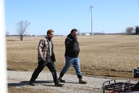 Ben Reinhold and Charles Pol head to the barn to plan out the lambing pen they need to build for the pregnant merino sheep that are due to give birth soon. (National Geographic)