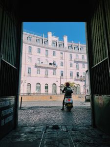 Mariana van Zeller rides a moped through the streets of Portugal. (National Geographic for Disney)