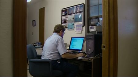 Ivor van Heerden working at his desk. (Australian Broadcasting Corporation)