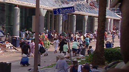 Stranded New Orleans residents gather outside of the Convention Center following Hurricane Katrina in 2005. (CNN)