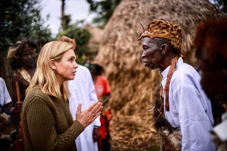 Mariana van Zeller speaks with the Mwani representative and is given a blessing to film in the forest. (National Geographic for Disney)