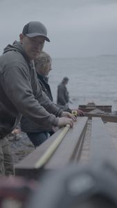 Troy Brockway, Sarah McDonald, and David Squibb construct a ramp from the beach up to Troy's property. (National Geographic/Gil Cano)