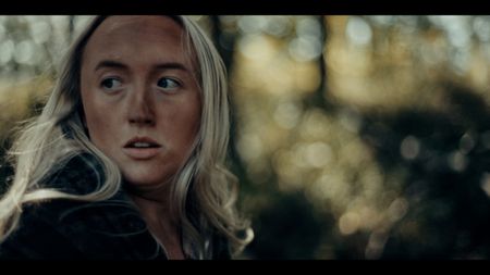 Recreation of Yde Girl running through forest. (2023 BOG PEOPLE SEASON ONE INC.)