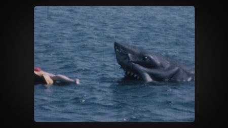 A still taken from Super 8 footage of the mechanical shark in the water on the set of Jaws. (Credit: Abby Fligor)