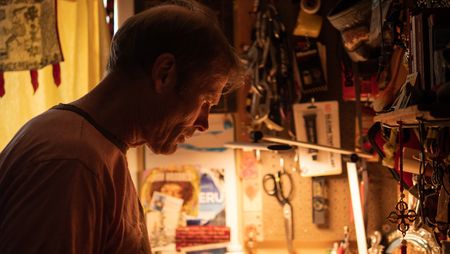 Conrad Anker gets ready to film in his gear room at home.  (National Geographic/Elena Gaby)