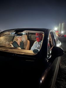 Mariana van Zeller talks to Chris in a car. (National Geographic for Disney)