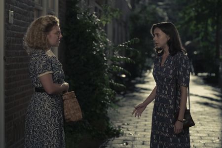 A SMALL LIGHT - Bep, played by Sally Messham, and Miep, played by Bel Powley, as seen in A SMALL LIGHT. (Credit: National Geographic for Disney/Dusan Martincek)