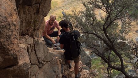 Conrad Anker unpacks while cinematographer Nick Kraus films him.  National Geographic/Elena Gaby)