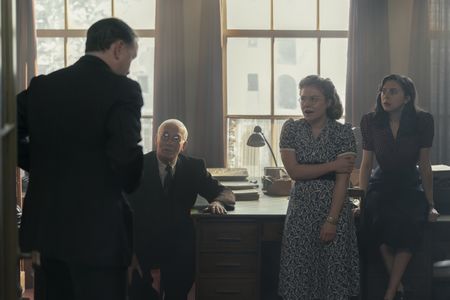 A SMALL LIGHT - Mr. Kugler tells a story to Mr. Kleiman, Bep, and Miep in the Opekta office as seen in A SMALL LIGHT. (From left: Nicholas Burns as Mr. Kugler, Ian McElhinney as Mr. Kleiman, Sally Messham as Bel, and Bel Powley as Miep). (Credit: National Geographic for Disney/Dusan Martincek)