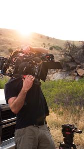 Cinematographer Nick Kraus gets ready to film Conrad Anker in the sunset. (National Geographic/Elena Gaby)