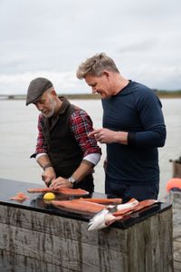 Iceland - L to R: Hakon teaches Gordon Ramsay how to fish for salmon the traditional way, using only a net. (Credit: National Geographic/Justin Mandel)