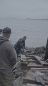 David Squibb helps construct a ramp on his neighbor's property. (National Geographic/Gil Cano)