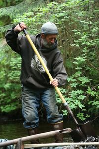 Dave Palmer rebuilds a community damn. (National Geographic/Wayne Moss)