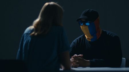 Mariana speaks with Colombian police informant Julian. (National Geographic)
