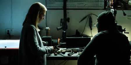 Mariana van Zeller inspects one of Tony's ghost guns. (National Geographic for Disney)