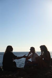 Mariana van Zeller sits with her best friend and cousin on the coast of Portugal. (National Geographic for Disney)
