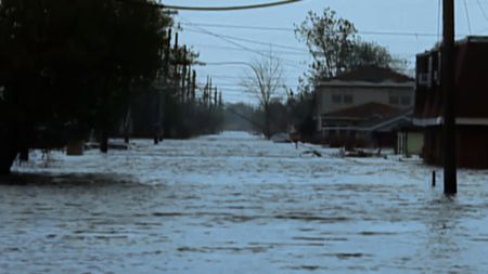 A residential street in New Orleans is flooded by Hurricane Katrina. (KURATOR/TEGNA/WWL)