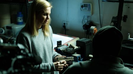 Mariana van Zeller inspects one of Tony's ghost guns. (National Geographic for Disney)