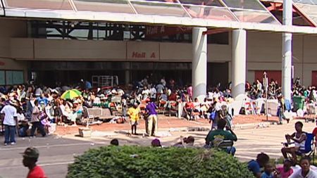 Stranded New Orleans residents gather outside of the Convention Center following Hurricane Katrina in 2005. (CNN)
