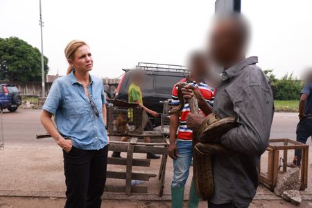 Mariana van Zeller speaks with the Boss about the animals for sale in the Kenshasa market. (National Geographic for Disney)
