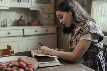 A SMALL LIGHT - Billie Boullet as Anne Frank in A SMALL LIGHT. (Credit: National Geographic for Disney/Dusan Martincek)