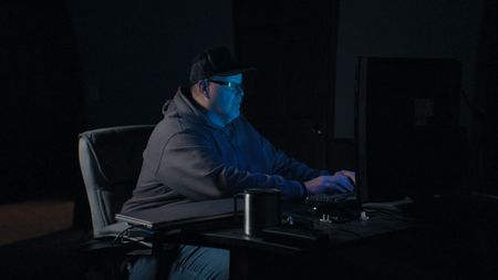 Robert Browning sits in his office hunting crypto scammers. (Photo credit: National Geographic)