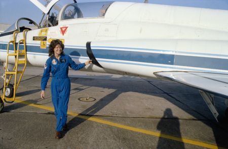 Astronaut Sally Ride next to a T-38 Jet during training at NASA Johnson Space Center. (Credit: NASA)