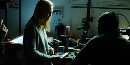 Mariana van Zeller inspects one of Tony's ghost guns. (National Geographic for Disney)