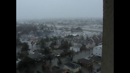 An aerial view of a levee breach and flooded New Orleans near Lake Marina Towers. (Paul Hellmers)