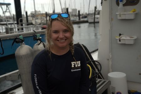 Scientist Erin Spencer on the docks at Riviera Beach. (National Geographic/Lisa Tanner)