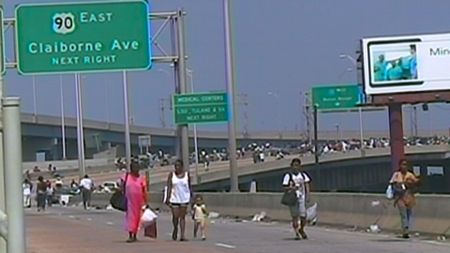 New Orleans residents walk down the Interstate trying to find refuge in the aftermath of Hurricane Katrina in 2005. (Global Imageworks, LLC.)