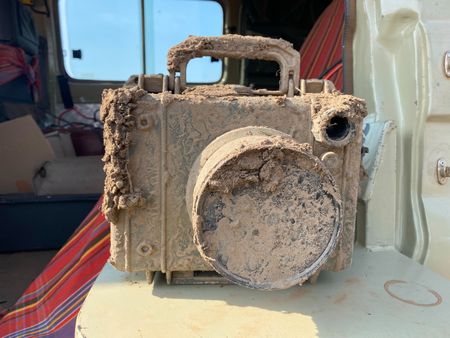 A remote camera set up to capture the wildebeest is caked in mud. (National Geographic for Disney/Charlie Luckock)