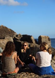 Mariana van Zeller sits with her best friend and cousin on the coast of Portugal. (National Geographic for Disney)